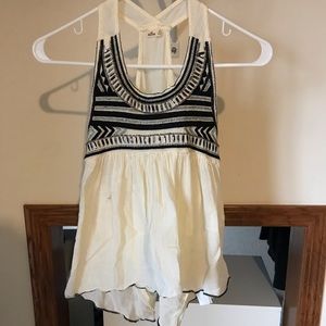 cream colored tank top with jewels on top